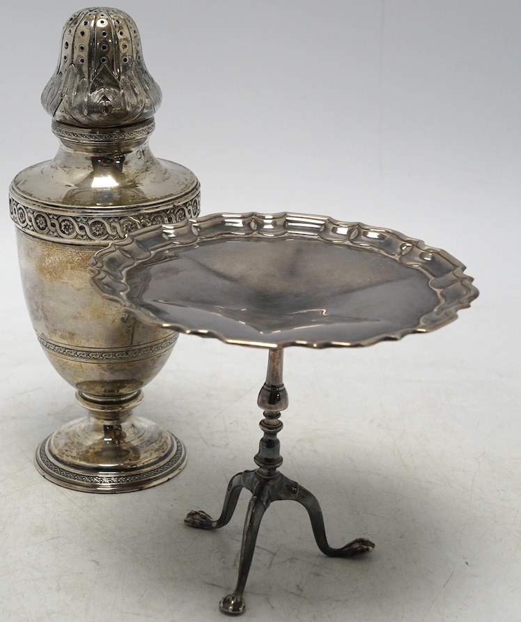 An Edwardian silver miniature model of a tripod table with piecrust border, Goldsmiths & Silversmiths Co Ltd, Sheffield, 1908, diameter 11.1cm, together with a French 950 standard white metal sugar caster, 7.3oz. Conditi